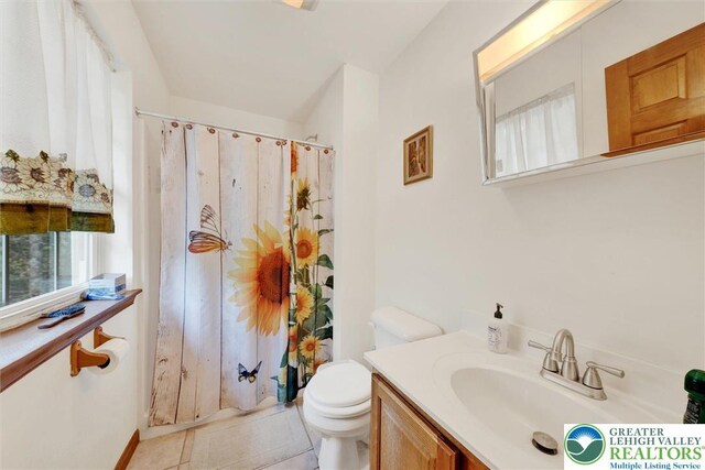 146 Bernadette Dr, Pike, PA 18328 - bathroom featuring toilet, vanity, a shower with shower curtain, and tile patterned flooring