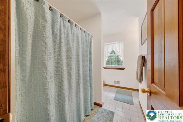 146 Bernadette Dr, Pike, PA 18328 - bathroom featuring tile patterned flooring, toilet, baseboards, and a shower with shower curtain