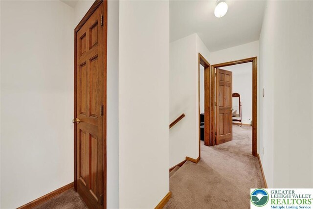 146 Bernadette Dr, Pike, PA 18328 - hallway with light colored carpet, an upstairs landing, and baseboards
