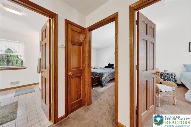 146 Bernadette Dr, Pike, PA 18328 - corridor featuring light carpet and baseboards