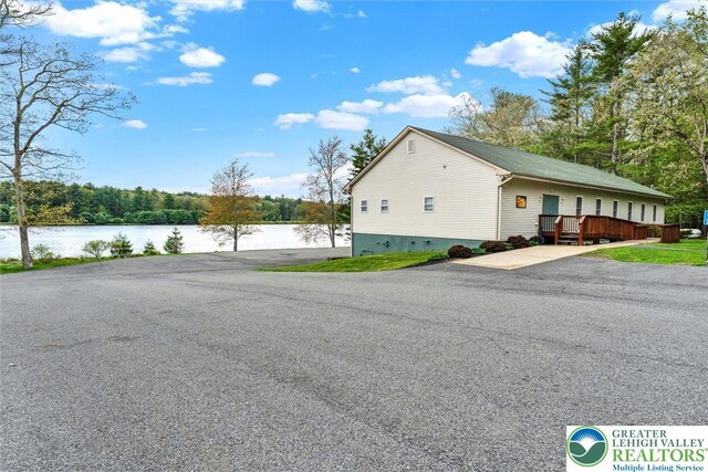 146 Bernadette Dr, Pike, PA 18328 - view of side of home with a deck with water view and crawl space