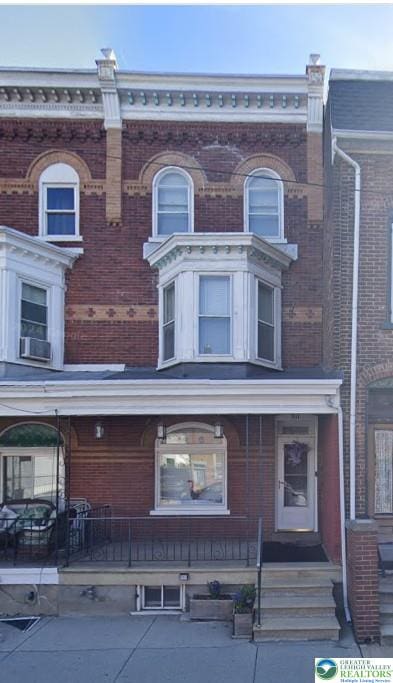 511 N 8th St, Allentown City, PA 18102 - townhome / multi-family property featuring a porch and brick siding
