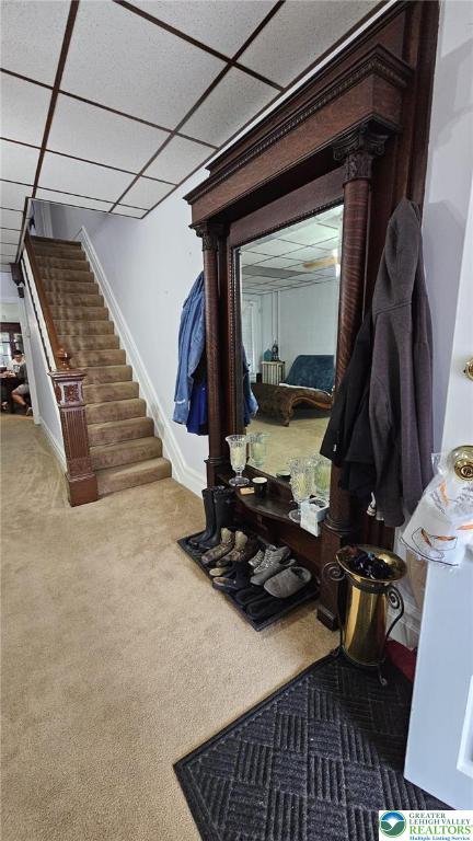 511 N 8th St, Allentown City, PA 18102 - living room with stairs, baseboards, carpet floors, and a paneled ceiling