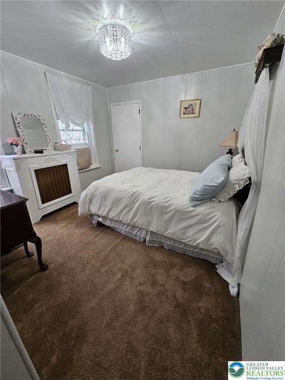 511 N 8th St, Allentown City, PA 18102 - carpeted bedroom with a chandelier