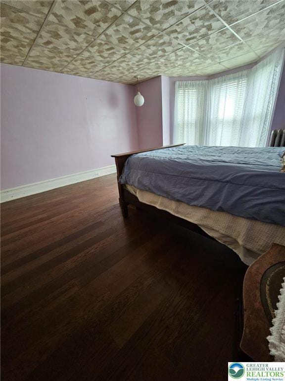 511 N 8th St, Allentown City, PA 18102 - bedroom featuring baseboards and wood finished floors