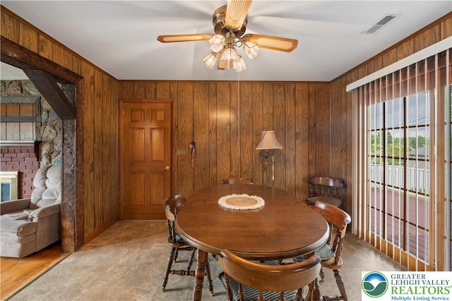 155 7th St, Tatamy Borough, PA 18085 - dining area with wooden walls and ceiling fan