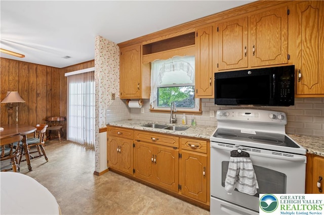 155 7th St, Tatamy Borough, PA 18085 - kitchen featuring black microwave, white range with electric stovetop, a sink, and backsplash
