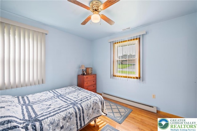 155 7th St, Tatamy Borough, PA 18085 - bedroom featuring a baseboard radiator, wood finished floors, and a ceiling fan