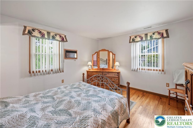 155 7th St, Tatamy Borough, PA 18085 - bedroom featuring multiple windows, wood-type flooring, and baseboards
