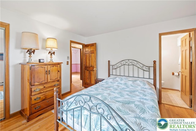 155 7th St, Tatamy Borough, PA 18085 - bedroom featuring light wood finished floors, baseboards, and ensuite bath