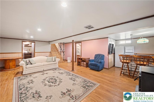 155 7th St, Tatamy Borough, PA 18085 - living area featuring stairway, wainscoting, and wood finished floors