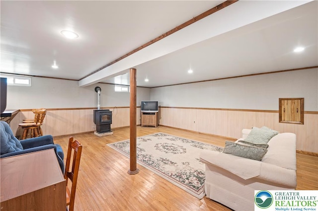 155 7th St, Tatamy Borough, PA 18085 - living area with a wood stove, wainscoting, and wood finished floors