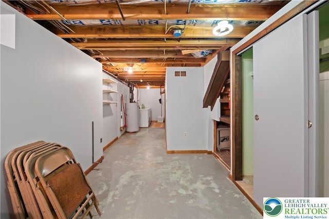 155 7th St, Tatamy Borough, PA 18085 - unfinished below grade area with water heater, baseboards, stairs, and washer / clothes dryer