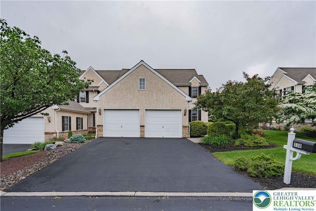 538 Parkside Ct, Allentown City, PA 18104 - traditional-style house with asphalt driveway and stone siding