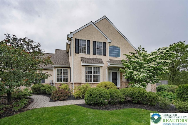 538 Parkside Ct, Allentown City, PA 18104 - traditional home featuring stone siding, stucco siding, and a front yard
