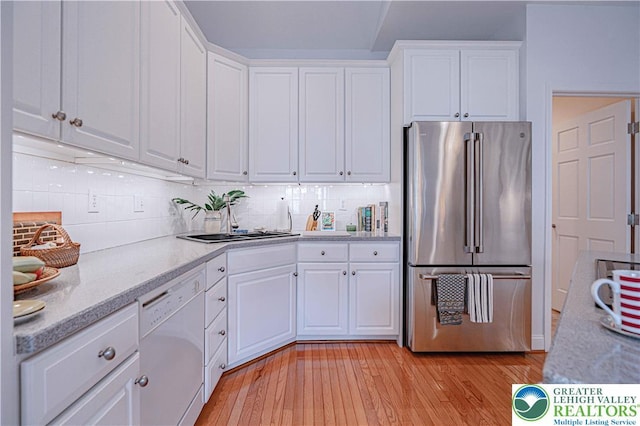 538 Parkside Ct, Allentown City, PA 18104 - kitchen featuring high end refrigerator, dishwasher, white cabinetry, and decorative backsplash