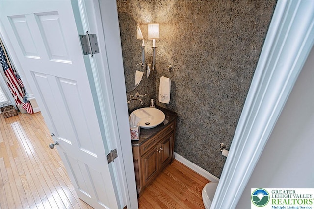 538 Parkside Ct, Allentown City, PA 18104 - bathroom featuring vanity, wood finished floors, and toilet