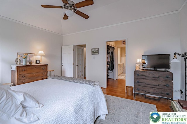 538 Parkside Ct, Allentown City, PA 18104 - bedroom with wood finished floors, crown molding, a ceiling fan, ensuite bathroom, and lofted ceiling