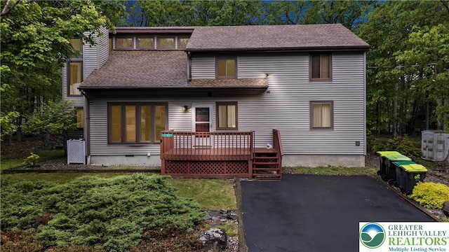 1117 Belaire Dr, Stroud Twp, PA 18301 - back of house featuring a deck, roof with shingles, and a patio area