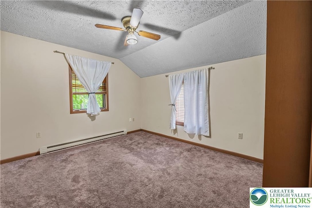 1117 Belaire Dr, Stroud Twp, PA 18301 - carpeted empty room featuring baseboard heating, healthy amount of natural light, a ceiling fan, a textured ceiling, and baseboards