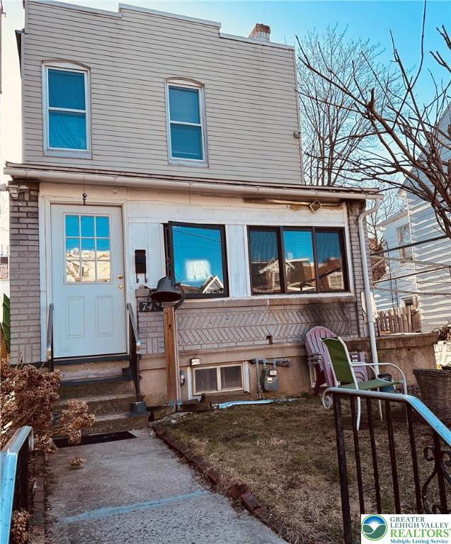 742 N 4th St, Allentown City, PA 18102 - townhome / multi-family property with a chimney and entry steps