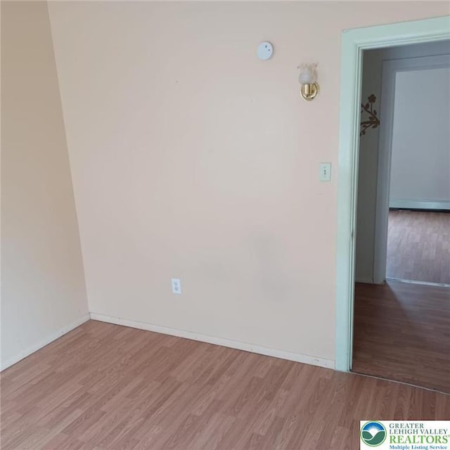 617 Oak St, Allentown City, PA 18102 - spare room with wood finished floors, baseboards, and a smoke detector