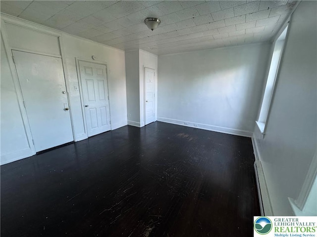 734 W Gordon St, Allentown City, PA 18102 - unfurnished bedroom with dark wood-style flooring and baseboards