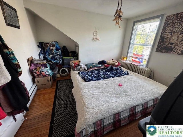 734 W Gordon St, Allentown City, PA 18102 - bedroom featuring wood finished floors and a baseboard radiator