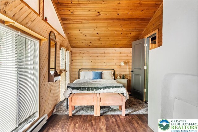 105 Honovi Dr, Tobyhanna Twp, PA 18347 - bedroom with vaulted ceiling, a baseboard radiator, wooden walls, wood ceiling, and dark wood finished floors