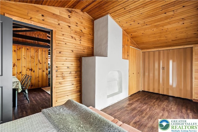 105 Honovi Dr, Tobyhanna Twp, PA 18347 - interior space with vaulted ceiling, wooden ceiling, wood walls, and dark wood-style floors