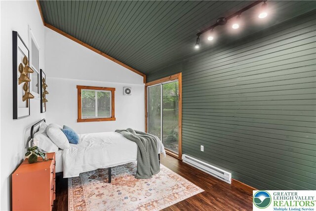105 Honovi Dr, Tobyhanna Twp, PA 18347 - bedroom with a baseboard heating unit, dark wood-type flooring, vaulted ceiling, wooden ceiling, and wood walls
