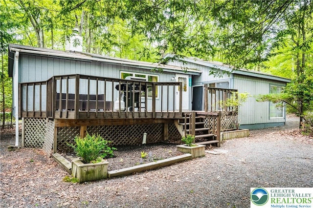 105 Honovi Dr, Tobyhanna Twp, PA 18347 - rear view of house featuring a wooden deck and stairs