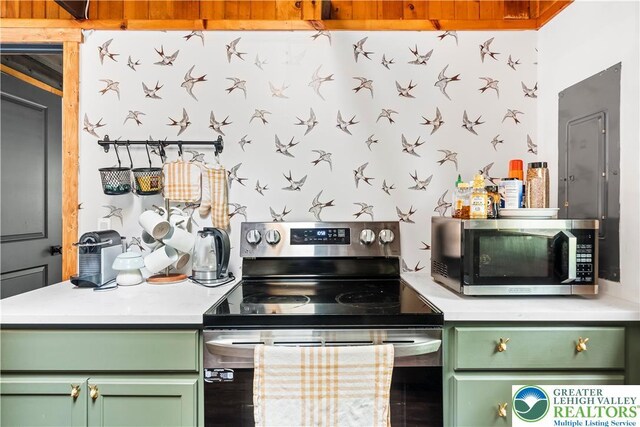 105 Honovi Dr, Tobyhanna Twp, PA 18347 - kitchen with green cabinetry, stainless steel appliances, light countertops, and wallpapered walls