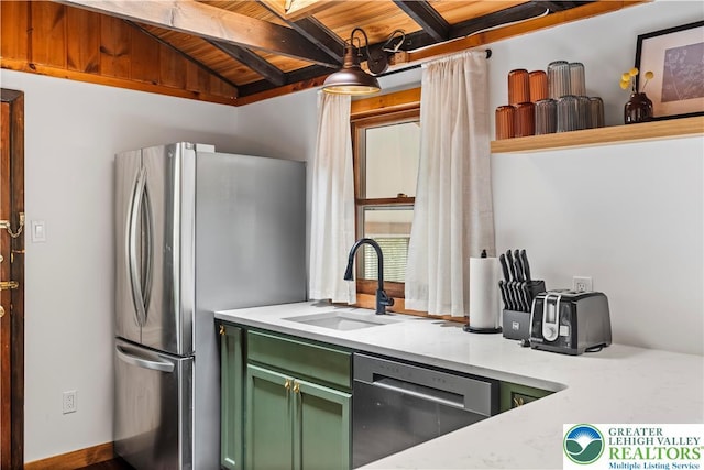 105 Honovi Dr, Tobyhanna Twp, PA 18347 - kitchen featuring green cabinets, appliances with stainless steel finishes, a sink, wood ceiling with exposed beams, and light countertops