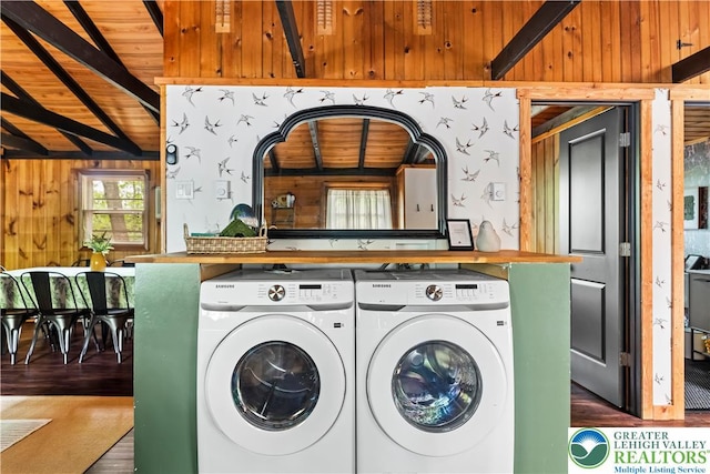 105 Honovi Dr, Tobyhanna Twp, PA 18347 - laundry room with washing machine and clothes dryer, wood walls, wooden ceiling, and wood finished floors