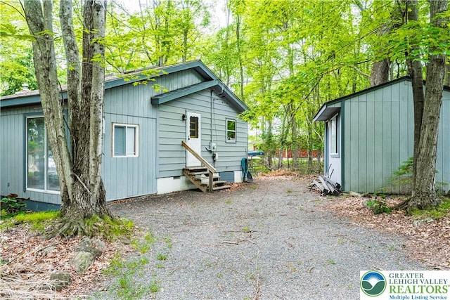 105 Honovi Dr, Tobyhanna Twp, PA 18347 - back of house with entry steps and an outbuilding