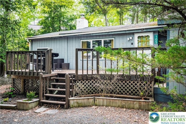 105 Honovi Dr, Tobyhanna Twp, PA 18347 - rear view of house with a chimney, a deck, stairs, and a shingled roof