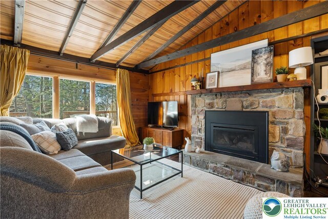105 Honovi Dr, Tobyhanna Twp, PA 18347 - living area with wooden walls, a stone fireplace, and wood ceiling