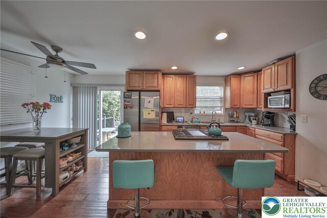 48 Craigie St, Easton, PA 18045 - kitchen with stainless steel appliances, a breakfast bar, tasteful backsplash, a ceiling fan, and recessed lighting