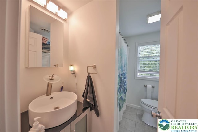 48 Craigie St, Easton, PA 18045 - full bath featuring tile patterned flooring, toilet, vanity, and a shower with curtain
