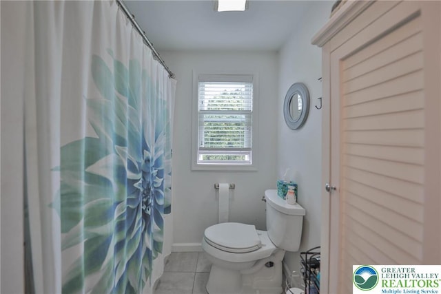 48 Craigie St, Easton, PA 18045 - full bath featuring toilet, tile patterned floors, and a shower with curtain