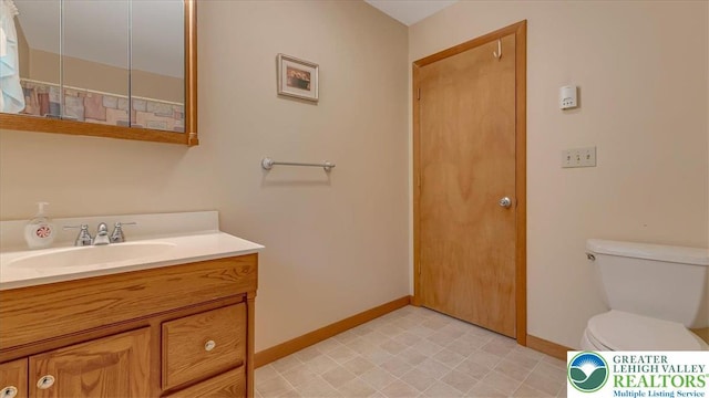 54 Indian Trl, Penn Forest Township, PA 18229 - bathroom with baseboards, vanity, and toilet