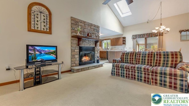 54 Indian Trl, Penn Forest Township, PA 18229 - living room with a chandelier, light colored carpet, a skylight, high vaulted ceiling, and a fireplace