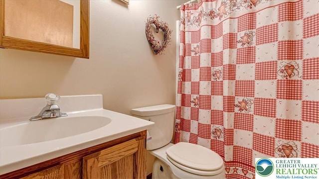 54 Indian Trl, Penn Forest Township, PA 18229 - bathroom featuring vanity, toilet, and a shower with curtain