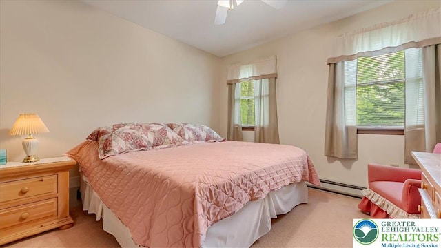 54 Indian Trl, Penn Forest Township, PA 18229 - bedroom featuring a baseboard heating unit, light carpet, and a ceiling fan
