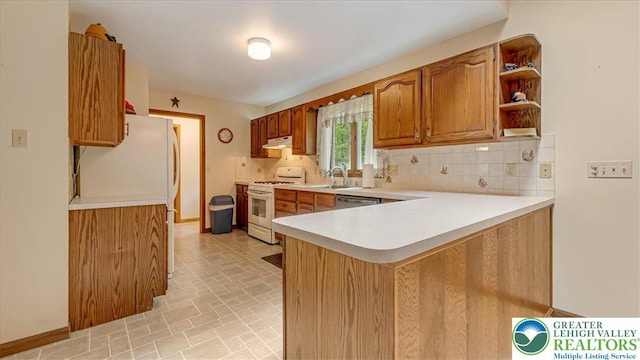 54 Indian Trl, Penn Forest Township, PA 18229 - kitchen featuring white appliances, tasteful backsplash, light countertops, and a sink