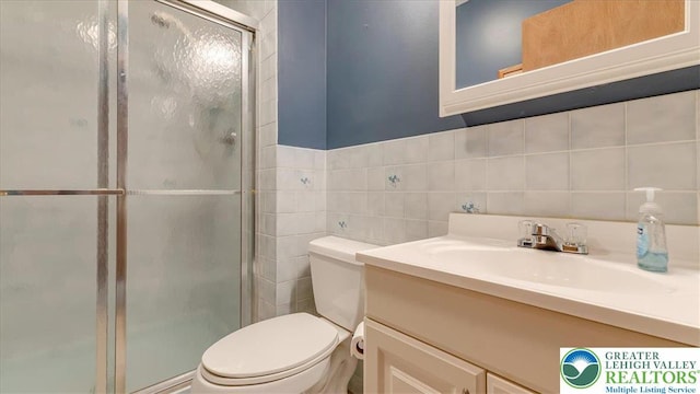 54 Indian Trl, Penn Forest Township, PA 18229 - bathroom with vanity, toilet, a stall shower, and tile walls
