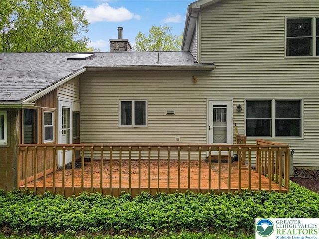 54 Indian Trl, Penn Forest Township, PA 18229 - rear view of property with a wooden deck and a chimney