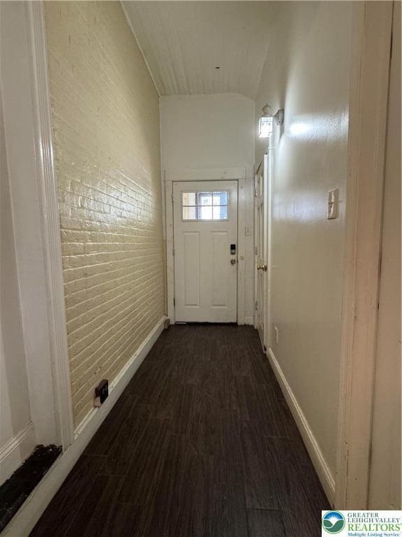 528 N 6th St, Allentown City, PA 18102 - doorway with dark wood-style floors, baseboards, and brick wall