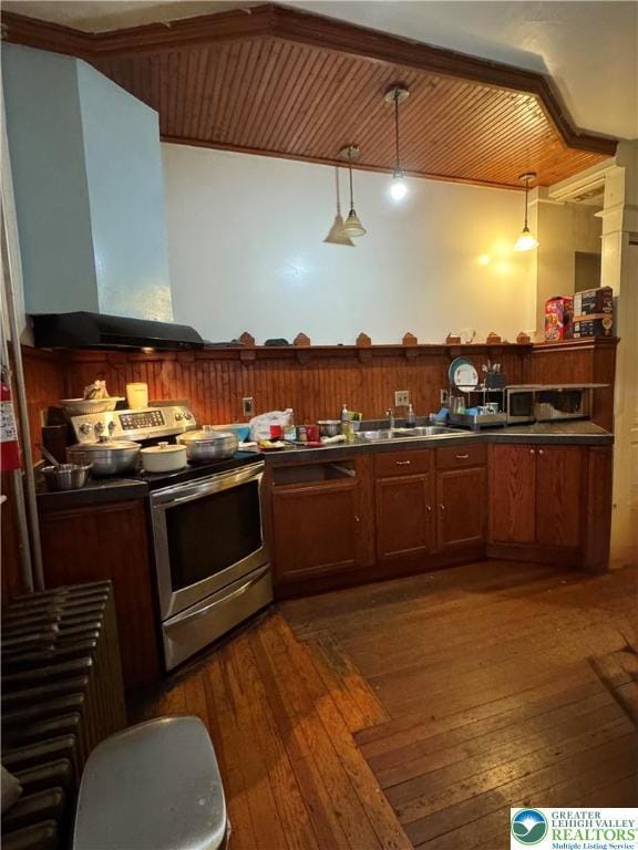 528 N 6th St, Allentown City, PA 18102 - kitchen with electric range, wall chimney exhaust hood, dark wood-style floors, and dark countertops